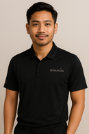 Man wearing a black polo shirt with 'SENANGIN' logo on a beige background