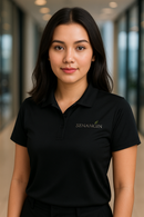 Woman wearing a black polo shirt with a logo in an indoor setting